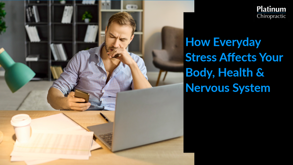 Desk with a laptop, phone, and coffee showing everyday sources of stress on the body